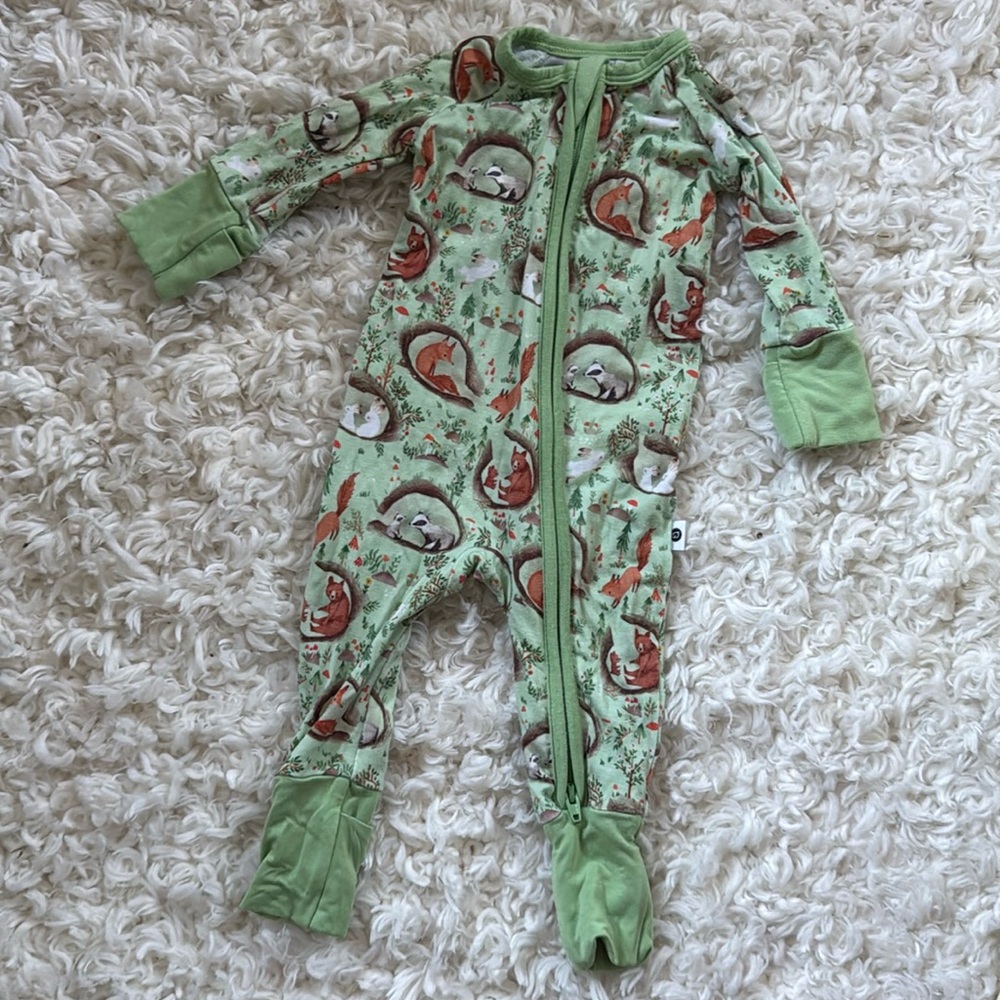 Newborn Kindthing zipper footie pajamas in woodland print